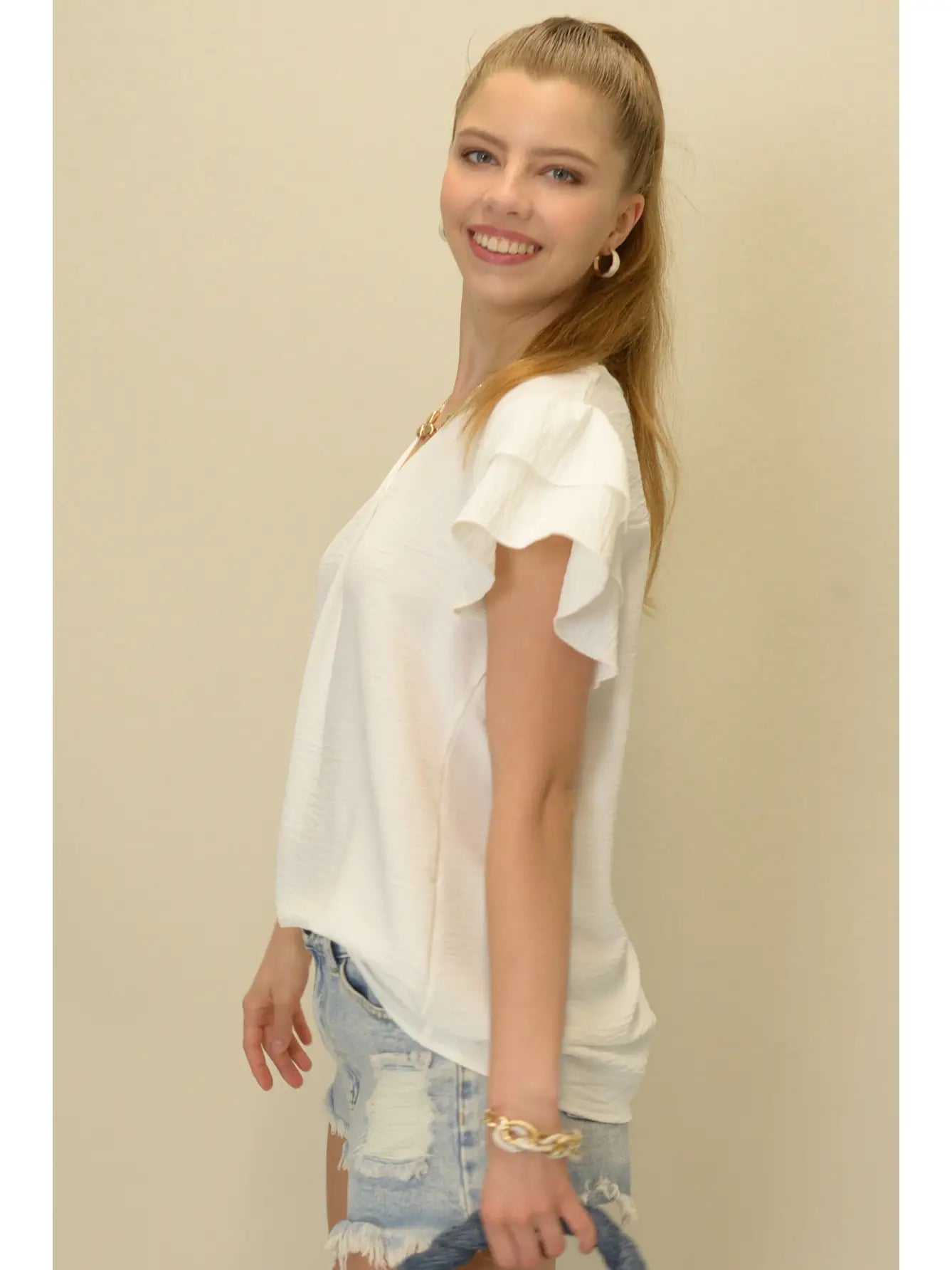 Short sleeve, v-neck blouse with a flutter sleeve