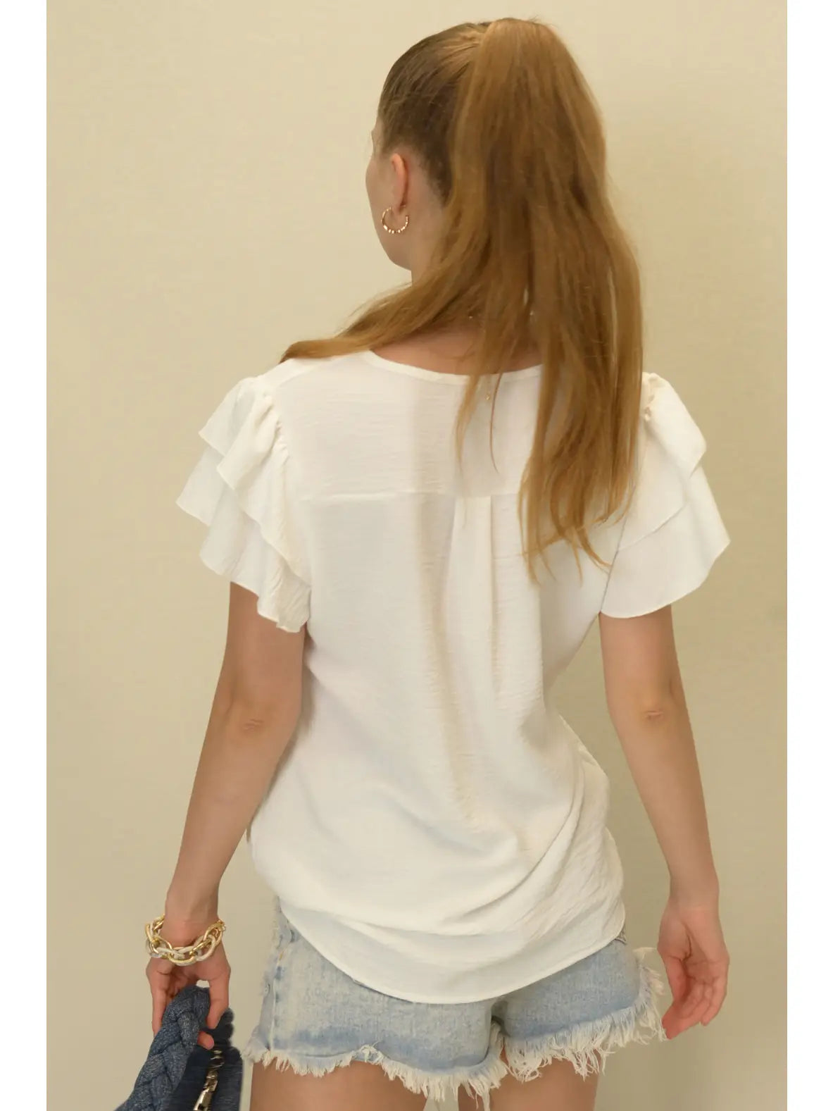 Short sleeve, v-neck blouse with a flutter sleeve
